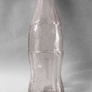 Retro Cola Bottle - Tint: slight amber tint with micro bubbles Classic cola bottle - slight micro bubbles and some wax drip. Breakaway cola bottle suitable for feature film live action, theatre or events.